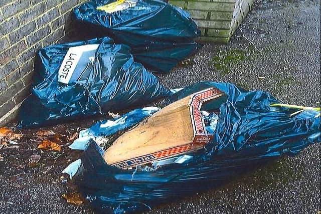 Photo of fly tipped black bags full of household waste