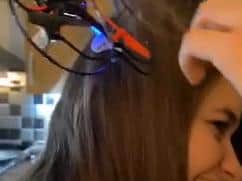 The drone in Holly's hair. Footage: SWNS