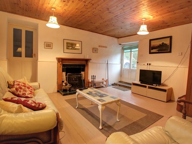 This lovely lounge also boasts a feature fireplace.