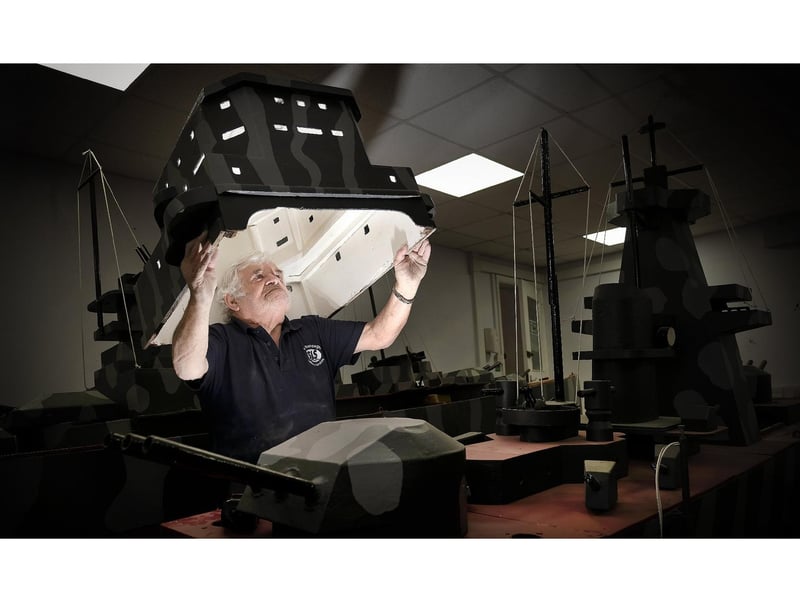 Trevor Frankland checks the Battleship turret.