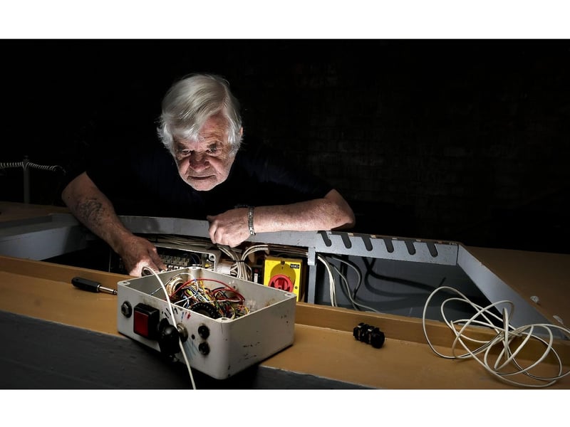Trevor Frankland working on the boat's electrics.
