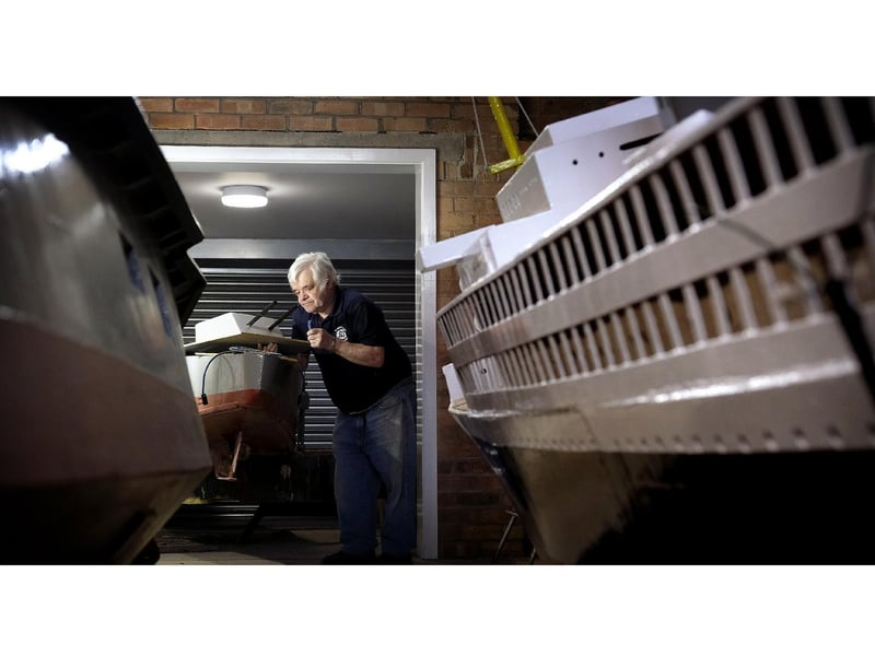 Trevor Frankland works on the boat's electrics.