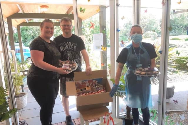 Emma and Terry donated cakes and biscuits to the home