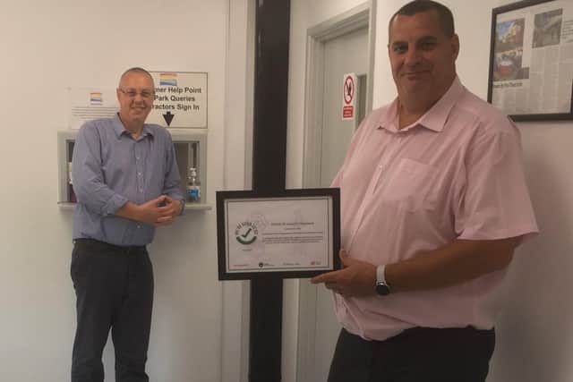 Centre Manager, Ian Welland and Security Manager Phillip Stiff with 'We’re Good to Go' certificate