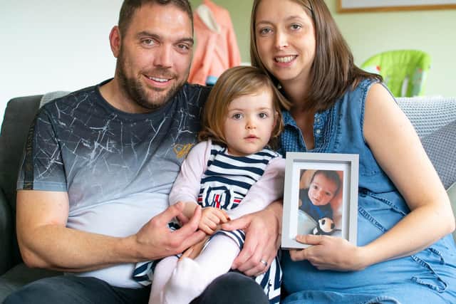Simon, Karen and Katie, and a picture of Dylan