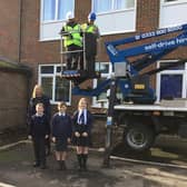 Installation of swift boxes high on school building, using cherry picker