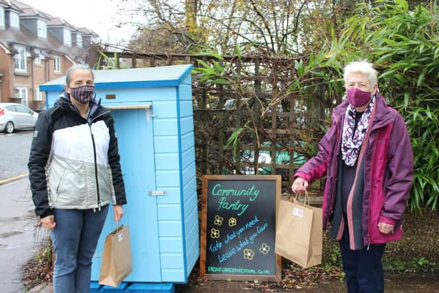 Jo Fisher, who volunteers for the meal service, with Joan Fisher, the co-founder of Open Door, outside the Pantry