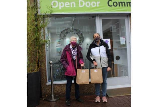 Joan Fisher, the co-founder of Open Door, with Jo Fisher, who volunteers for the meal service