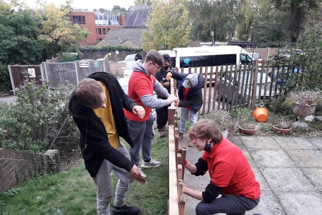 The team fixing the fence