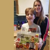 Emma Jenkins and son Austin with the new blender they received
