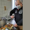 PCSO Simon Jackman serves up dinner for the homeless on Christmas Day