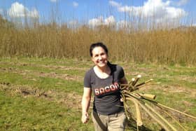 Candice Hunt collecting wood for the pen project
