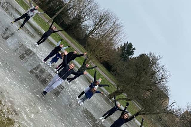 Skaters take advantage of the cold weather by practicing their routines on frozen puddles in Hemel Hempstead