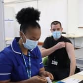 Benedicta Ajulufoh - HCT immunisation nurse with patient at Robertson House