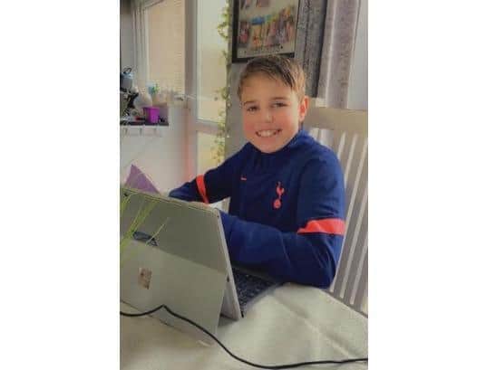 Ronnie working on the Affinity Water laptop at home (C) Affinity Water