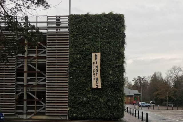 Extinction Rebellion erect HS2 protest banner on multi-storey car park ...