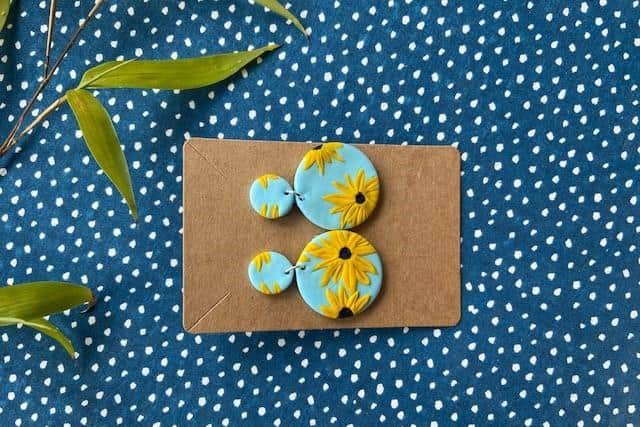 Holly makes the earrings and sells them on her online shop on Etsy
