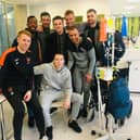 Spencer with some of his teammates before he travelled abroad for treatment