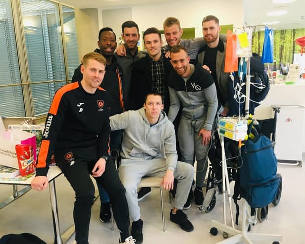 Spencer with some of his teammates before he travelled abroad for treatment