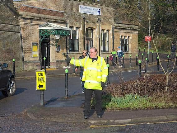 Matthew marshalling traffic at the start of the Rotary Half Marathon in 2018