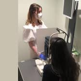 Stephanie Crowe, Pre-Registration Optometrist with a customer