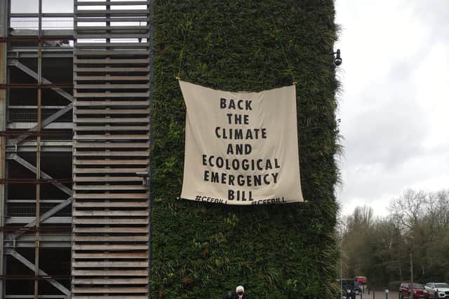 Volunteers supporting the Climate and Ecological Emergency Bill, hung a banner from the multistorey in Berkhamsted