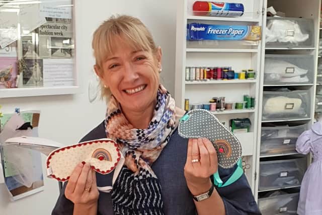 Dawn Clarke with the eye masks she's designed for NHS workers