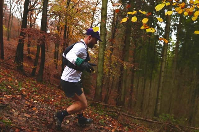 Andrew running through the woods in Wendover