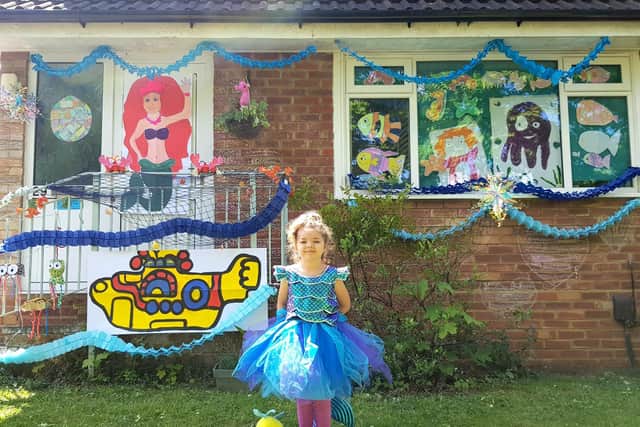 Ruby in front of their 'Under The Sea' display