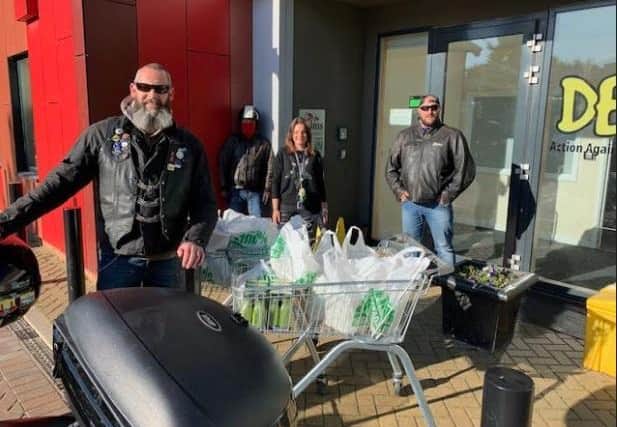 Motorbike riders deliver cooked meals to DENS homeless shelter