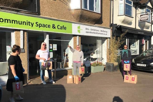 Handing out cooked meals