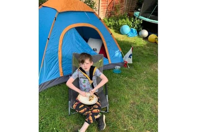 Flynn (1st Apsley) had dinner outside his tent