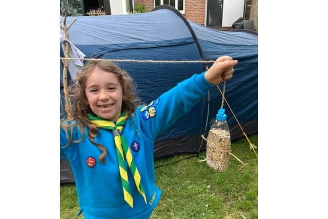 Poppy (1st Leverstock Green) with a bird feeder she made
