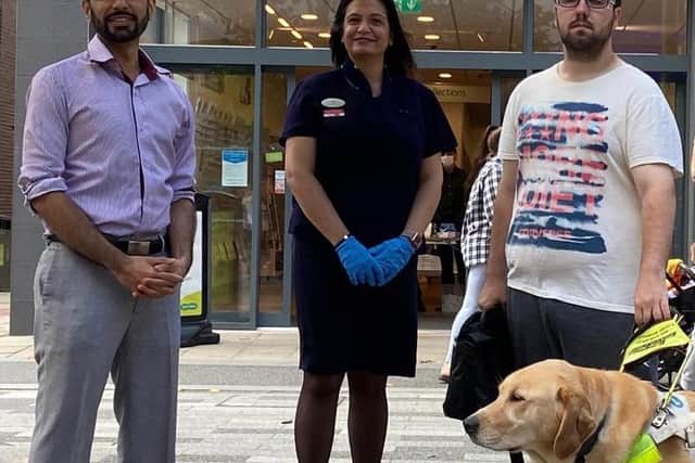 Shane Abbas Bhimani, clinical director; Priti Amrania, dispensing assistant and PR ambassador; Colin Perriera and his guide dog Sid