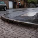 The resident is concerned that if the drains are blocked the water sitting on the roads will make them dangerous in the winter
