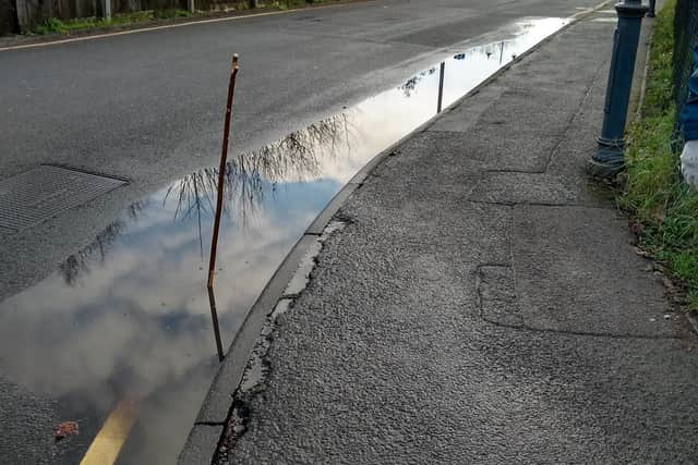 Water sitting on the road in Berkhamsted