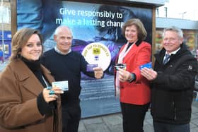 Cllr Margaret Griffiths, Phil Walker, and representatives from the Council's Community Safety and Strategic Housing Teams were the first to tap to donate