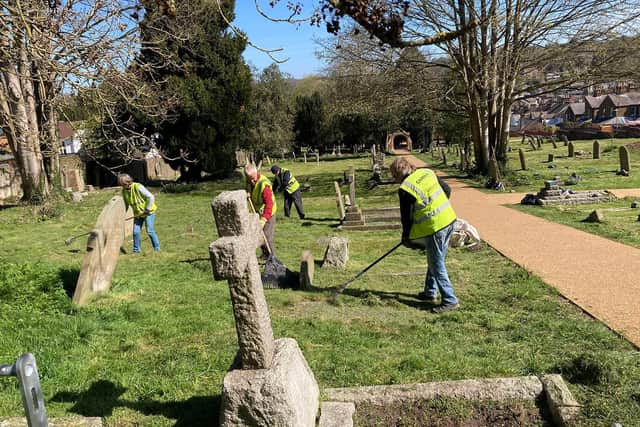 Volunteers tend the grounds