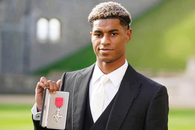 Footballer Marcus Rashford after receiving his MBE for services to Vulnerable Children in the UK during Covid-19 during an investiture ceremony at Windsor Castle on November 09, 2021 in Windsor, England. (Photo by Andrew Matthews - WPA Pool/Getty Images)