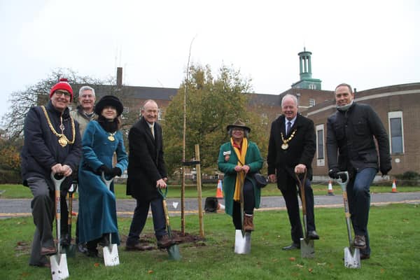 L to R: Cllr Bob Deering, Exec Member for Resources and Performance and Mayor of Hertford; Cllr Eric Buckmaster, Exec Member for The Environment; 
Cllr Annie Brewster, Vice-Chairman of Hertfordshire County Council; Cllr Richard Roberts, Leader of the Council; Kate Belinis, Deputy Lieutenant of Hertfordshire; Cllr Seamus Quilty, Chairman of Hertfordshire County Council; Owen Mapley, Chief Executive of Hertfordshire County Council planting trees at County Hall