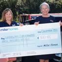 Lynn Margetts accepting the cheque from Miller Homes