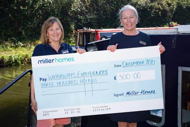 Lynn Margetts accepting the cheque from Miller Homes