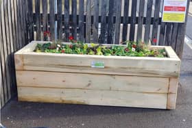 The Trust designed and made five planters from timber in its workshop, before transporting them to the station