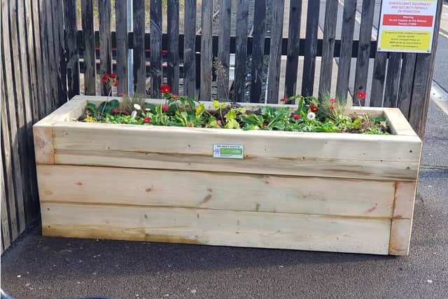 The Trust designed and made five planters from timber in its workshop, before transporting them to the station