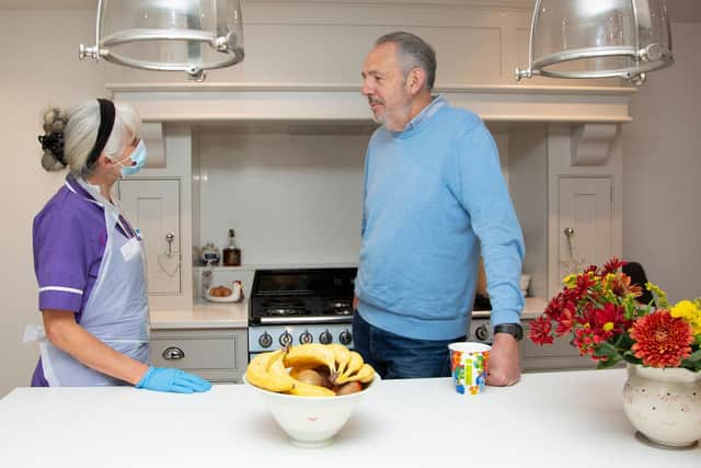 Rennie Grove Hospice at Home Nurse talking with a family member