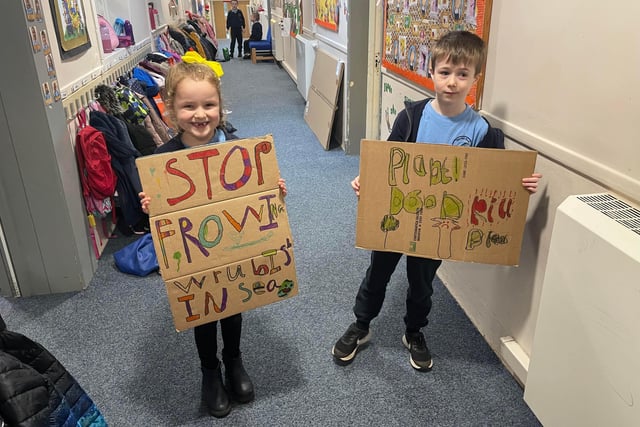 Warden Park Primary Year 2 class climate change protest. Sam and Scarlett.