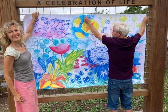 When the wall is complete it will reveal Jessica Ecott's vivid flower bed design