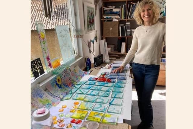 Jessica Ecott preparing the commemorative tiles in her studio