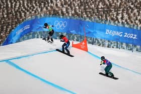 Charlotte Bankes (centre) in action during the Women's Snowboard Cross quarter-finals in Beijing