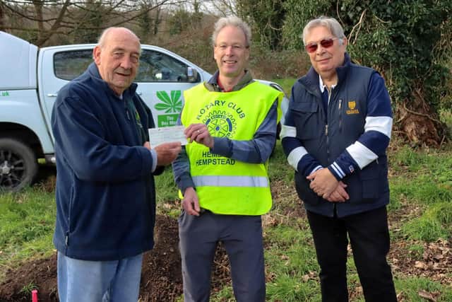 Peter Phillips, a trustee of the Box Moor Trust, receives a cheque from president Martin Horsted and Rod Pesch, of Hemel Rotary. (PHOTO BY: Iain Nibbsy)
